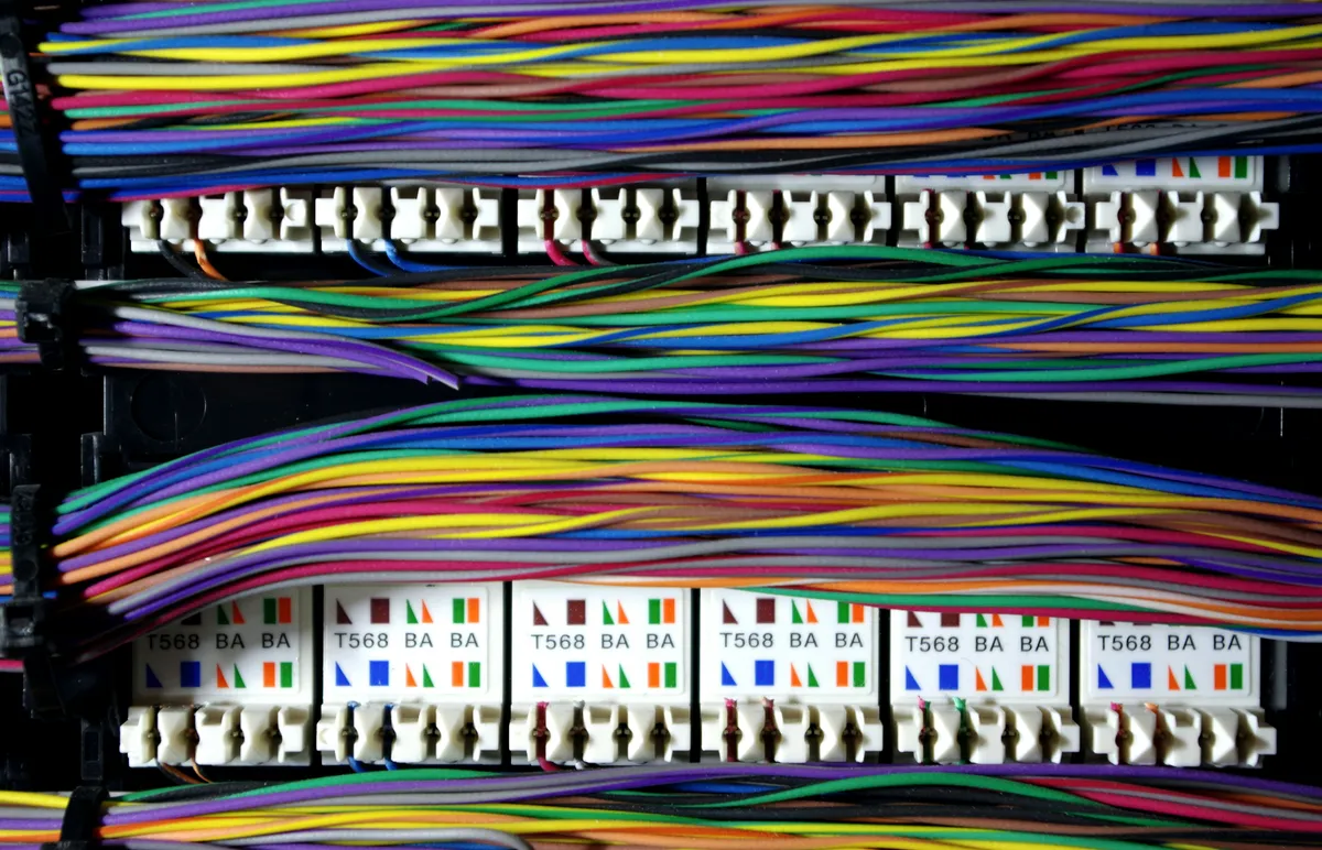 The Anatomy of Layer 1: Legacy Inertia and the Deprecation of the Crossover Cable